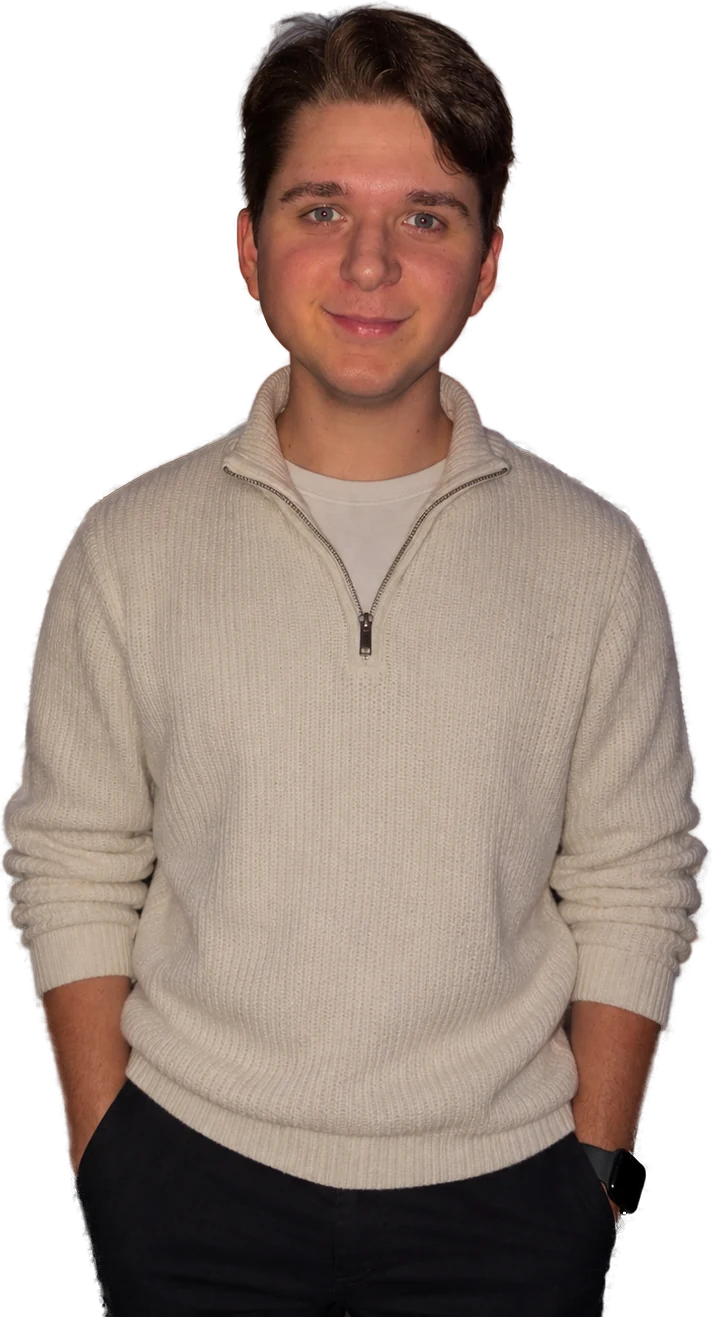 Sawyer Valin in a cream quarter-zip sweater, smiling